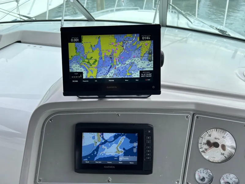 Slide: The Image of Dashboard of a 2000 Formula 34 PC boat with Garmin navigation displays. - 17