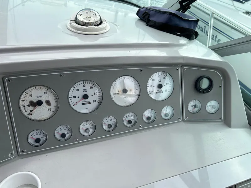 Slide: The Image of Control panel of a 2000 Formula 34 PC boat with gauges and compass. - 19