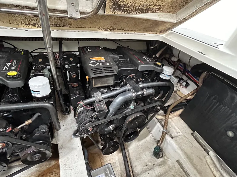 Slide: The Image of Engine compartment of a 2000 Formula 34 PC boat, featuring dual V8 engines. - 24