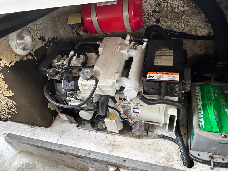 Slide: The Image of Engine compartment of a 2000 Formula 34 PC boat with Kohler power system. - 25