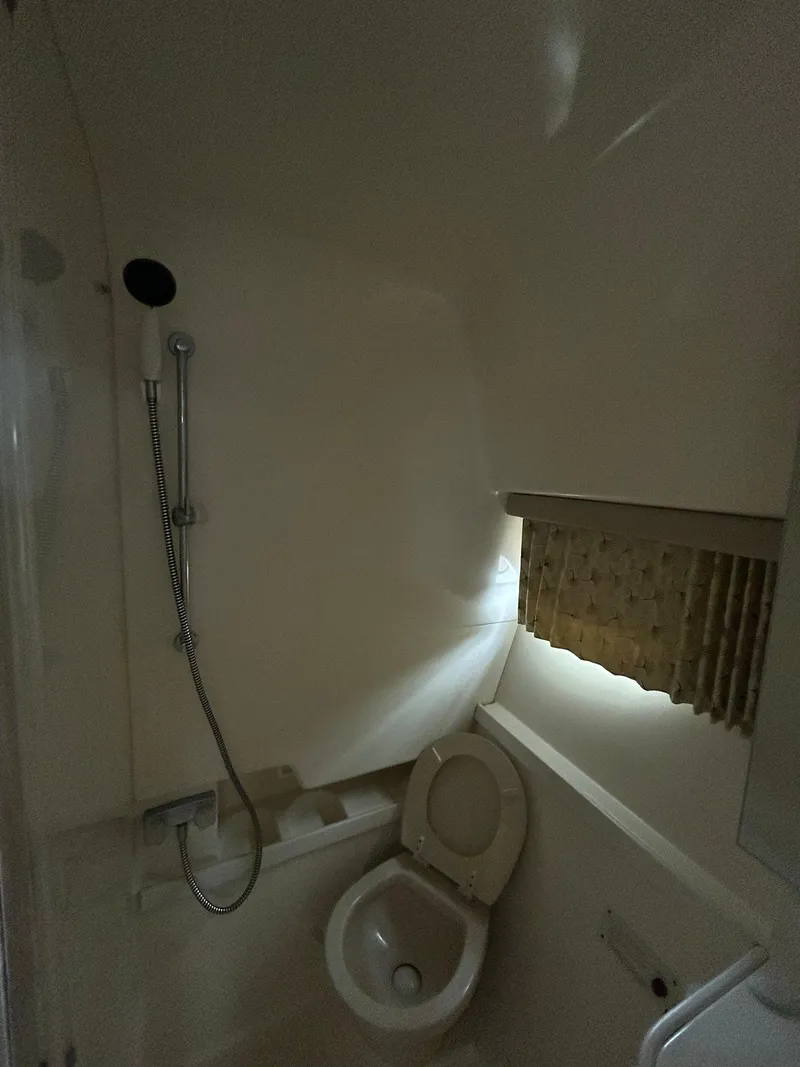 Slide: The Image of Bathroom interior of a 2000 Formula 34 PC boat with shower and toilet. - 35