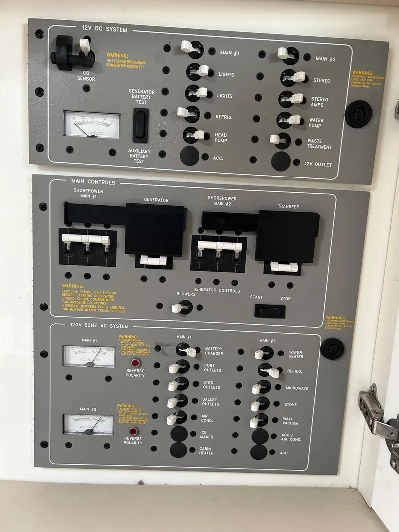 Slide: The Image of Control panel of a 2000 Formula 34 PC boat, featuring various switches and gauges. - 36
