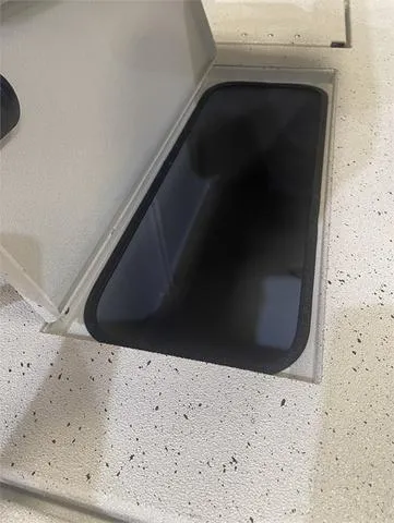 Slide: The Image of 2024 Xpress H22B W/Yamaha 175 SHO storage compartment. - 14