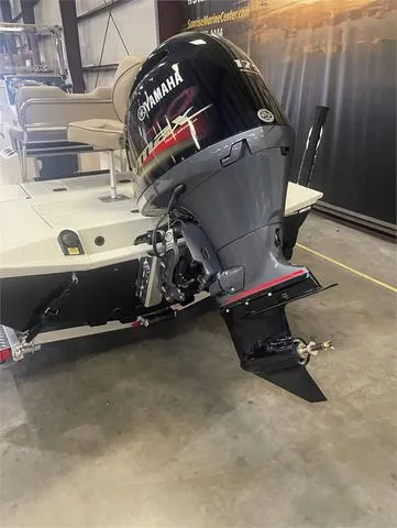 Slide: The Image of 2024 Xpress H22B boat with Yamaha 175 SHO outboard motor in a showroom. - 16