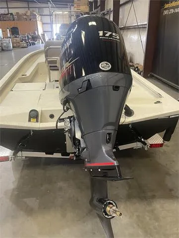 Slide: The Image of 2024 Xpress H22B boat with Yamaha 175 SHO outboard motor in warehouse. - 17