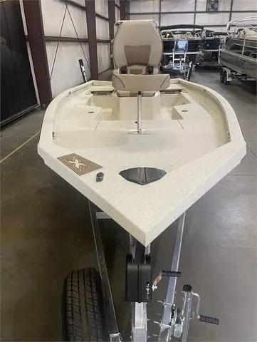 Slide: The Image of 2024 Xpress H22B boat with Yamaha 175 SHO engine in a warehouse. - 6