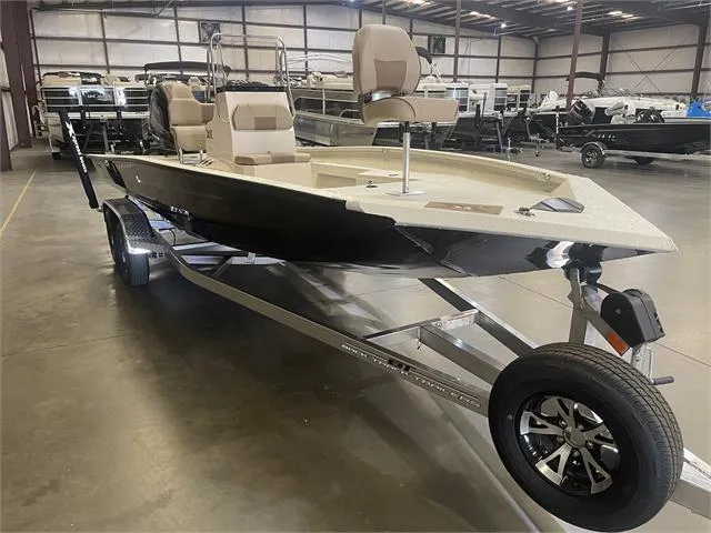 Slide: The Image of 2024 Xpress H22B boat with Yamaha 175 SHO engine on trailer in warehouse. - 7