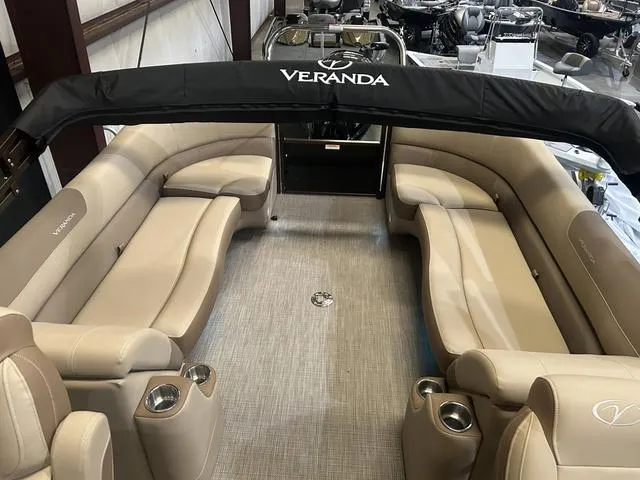 Slide: The Image of 2025 Veranda VR25RC pontoon boat interior with Yamaha 250 SHO engine, beige seating. - 18