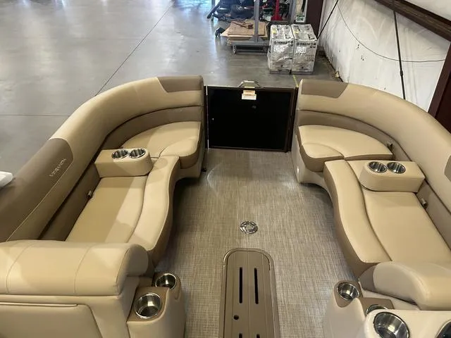 Slide: The Image of Interior of 2025 Veranda VR25RC pontoon boat with beige seating and cup holders. - 27