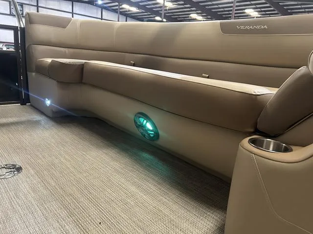 Slide: The Image of 2025 Veranda VR25RC boat interior with beige seating and LED lighting. - 30