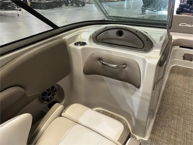 Slide: The Image of Interior of a 2018 Crownline E21X boat, featuring seating and storage compartments. - 12