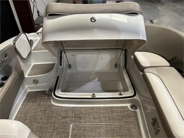 Slide: The Image of 2018 Crownline E21X boat interior storage compartment. - 16