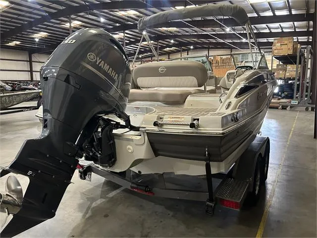 Slide: The Image of 2018 Crownline E21X boat with Yamaha outboard motor in warehouse. - 5