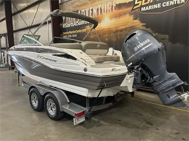 Slide: The Image of 2018 Crownline E21X boat with Yamaha outboard motor on trailer in showroom. - 6