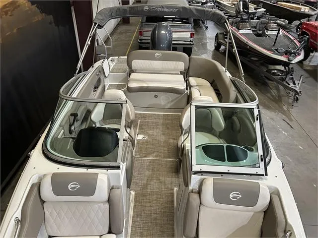 Slide: The Image of 2018 Crownline E21X boat interior with seating and windshield. - 8