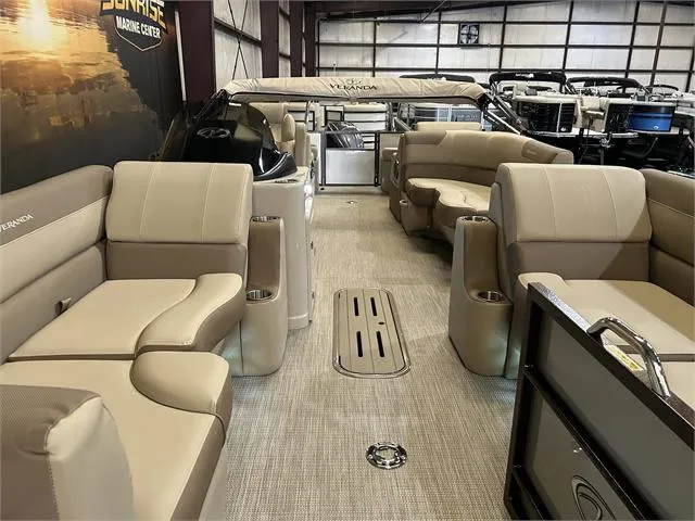 Slide: The Image of 2024 Veranda VR22RFL pontoon boat interior with beige seating and Yamaha 150 engine. - 19