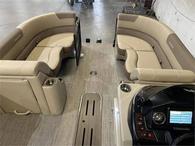 Slide: The Image of 2024 Veranda VR22RFL boat interior with beige seating and Yamaha 150 controls. - 22