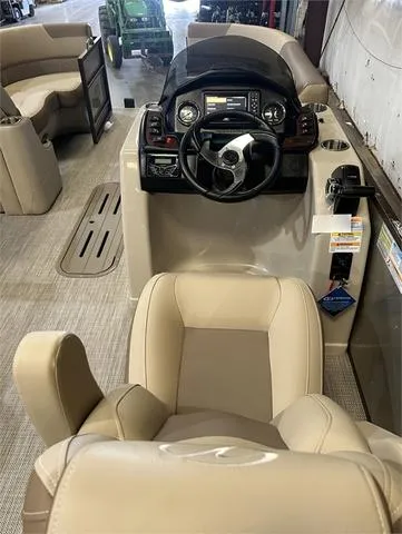 Slide: The Image of 2024 Veranda VR22RFL boat interior with Yamaha 150, featuring steering console and seating. - 24