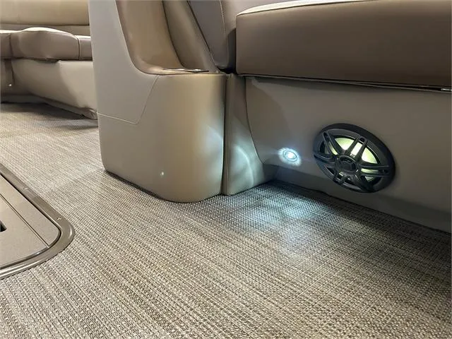 Slide: The Image of 2024 Veranda VR22RFL interior with speaker and ambient lighting on carpeted floor. - 26