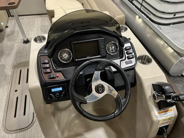 Slide: The Image of 2024 Veranda VR22RFL W/Yamaha 150 pontoon boat interior with beige seating. - 6