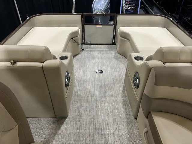 Slide: The Image of 2024 Veranda VR22RFL pontoon boat interior with Yamaha 150, featuring plush seating and modern dashboard. - 9