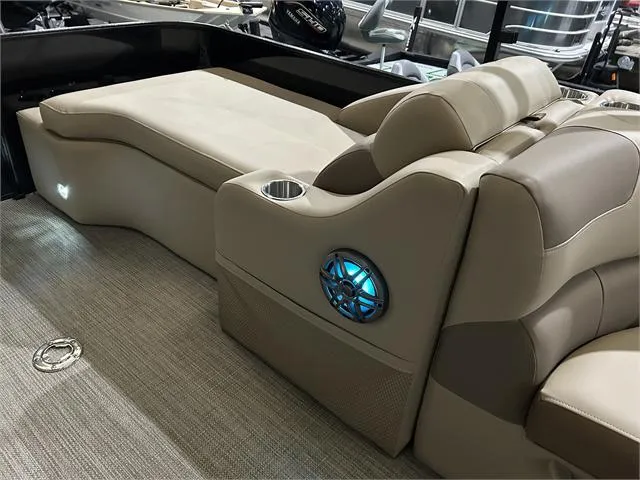 Slide: The Image of 2024 Veranda VR22RFL boat interior with beige seating and blue LED speaker. - 15