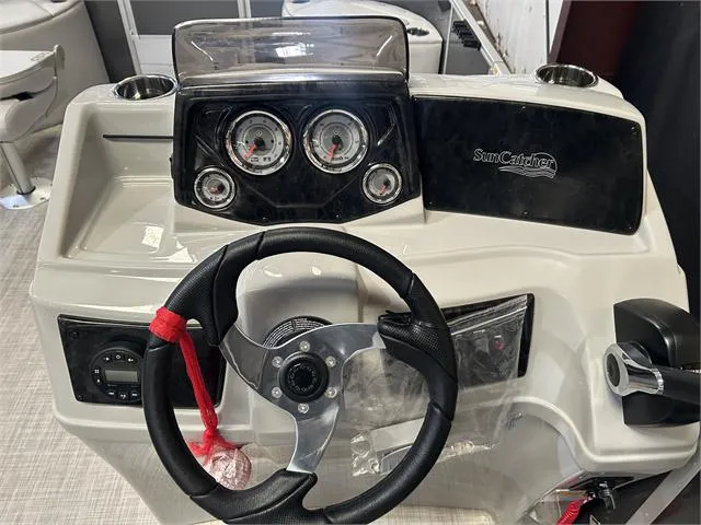 Slide: The Image of 2024 SunCatcher 20F boat dashboard with steering wheel and gauges. - 21