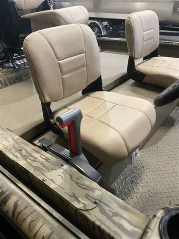 Slide: The Image of 2023 SeaArk RX 180 SC boat interior with beige seats and camo accents. - 13