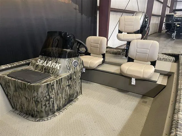 Slide: The Image of 2023 SeaArk RX 180 SC with Yamaha 90 SHO, camo design, interior view with seating. - 5
