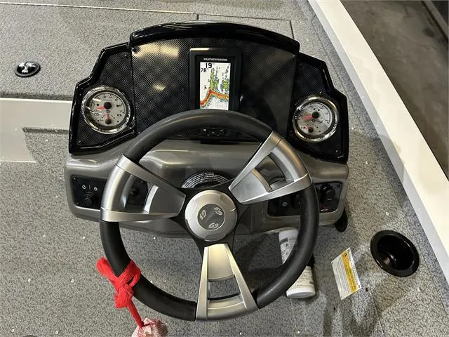 Slide: The Image of 2024 G3 Sportsman 1610 Vnl W/Yamaha 50HP boat dashboard with steering wheel and gauges. - 10