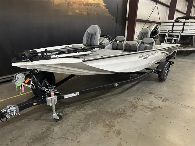 Slide: The Image of 2024 G3 Sportsman 1710 boat with Yamaha 90 HP SHO engine on trailer in warehouse. - 2