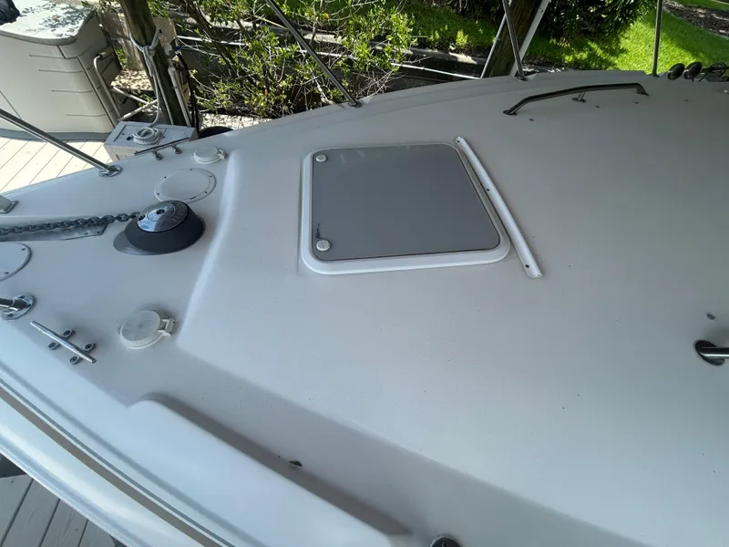 Slide: The Image of 2004 Larson 330 boat deck with hatch and anchor. - 12