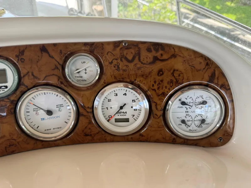 Slide: The Image of Close-up of 2004 Larson 330 boat dashboard with gauges and controls. - 33
