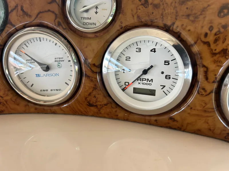 Slide: The Image of Close-up of 2004 Larson 330 boat dashboard gauges. - 34