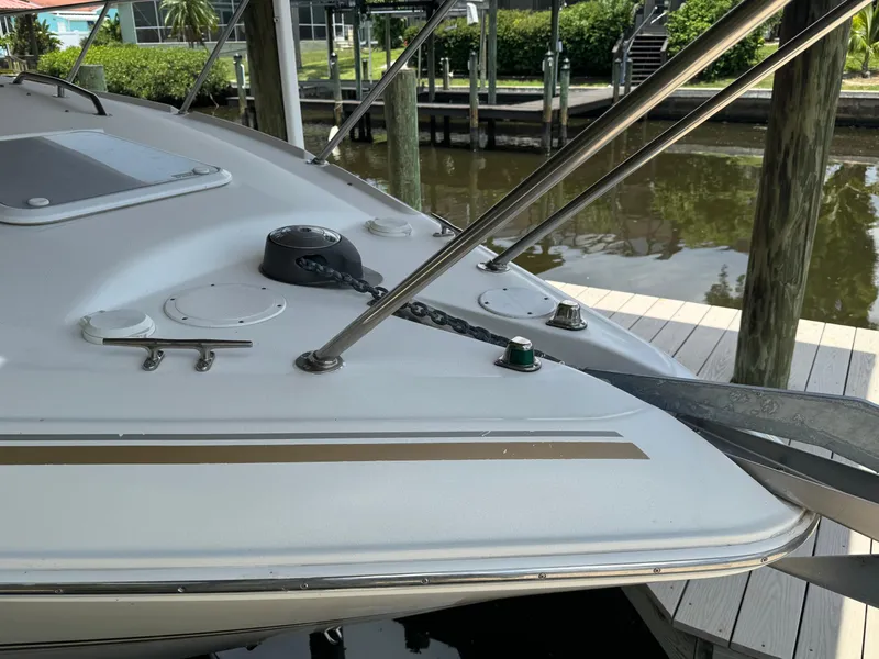 Slide: The Image of 2004 Larson 330 boat bow with anchor and deck fittings. - 6