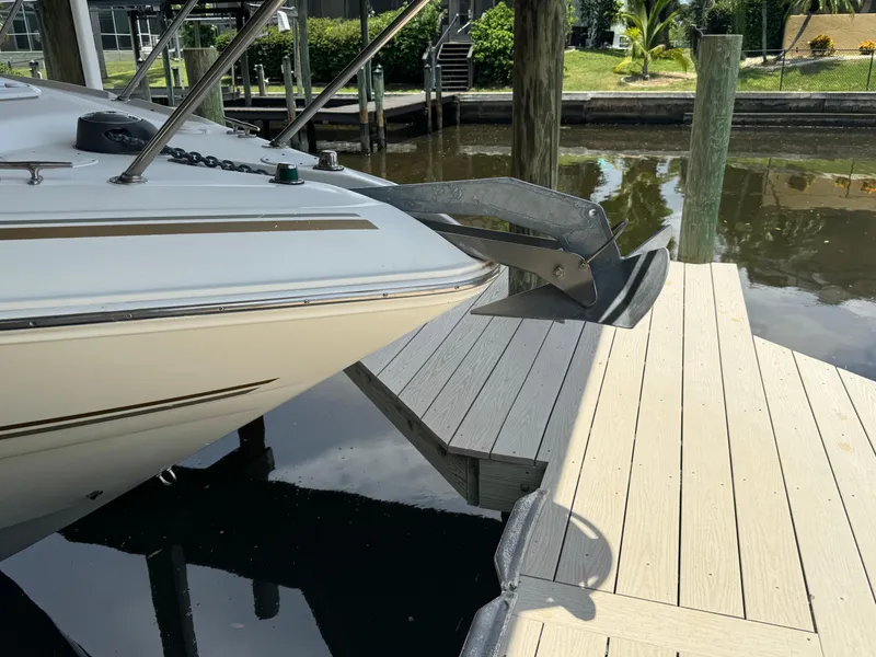 Slide: The Image of 2004 Larson 330 boat docked at a marina. - 8