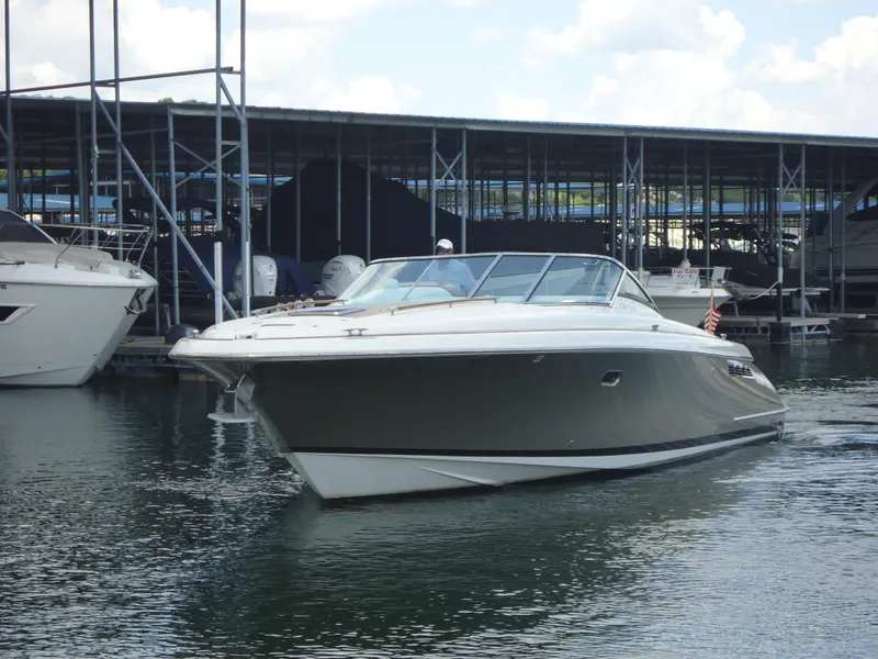 The Image of 2009 Chris-Craft Corsair 36 boat docked in a marina. - 0