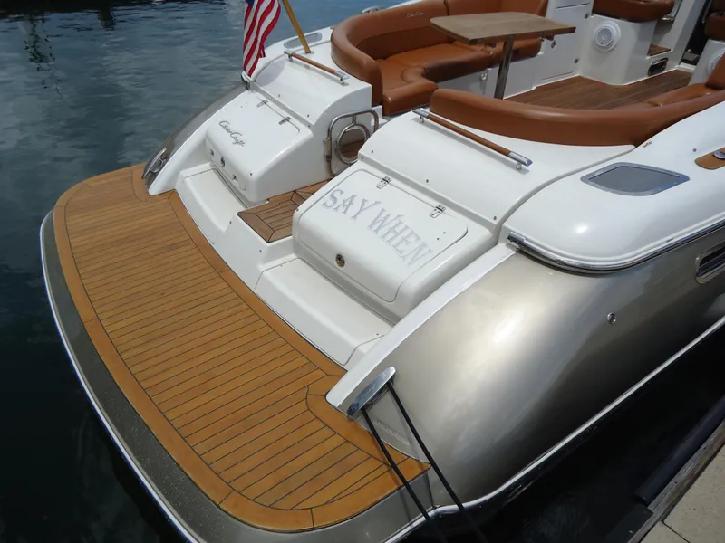 Slide: The Image of 2009 Chris-Craft Corsair 36 boat with teak swim platform and luxurious seating. - 10