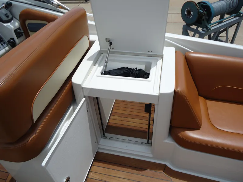 Slide: The Image of 2009 Chris-Craft Corsair 36 interior seating and storage compartment. - 13