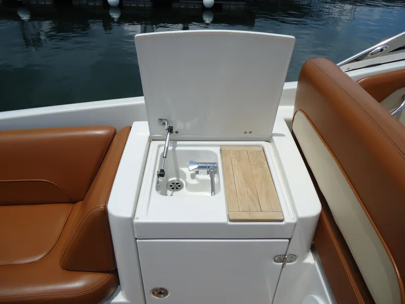 Slide: The Image of 2009 Chris-Craft Corsair 36 boat interior with sink and seating. - 14