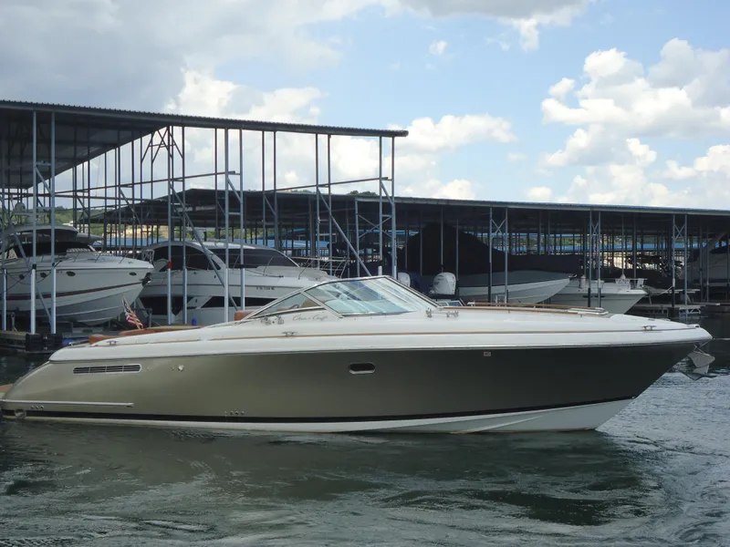 Slide: The Image of 2009 Chris-Craft Corsair 36 boat docked at a marina on a sunny day. - 3