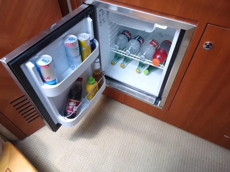 Slide: The Image of Mini fridge stocked with beverages on a 2009 Chris-Craft Corsair 36 boat. - 31