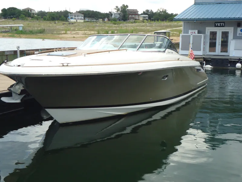 Slide: The Image of 2009 Chris-Craft Corsair 36 boat docked at a marina. - 33