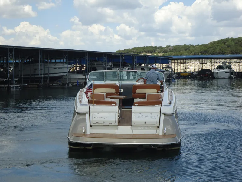 Slide: The Image of 2009 Chris-Craft Corsair 36 boat docked in a marina. - 4