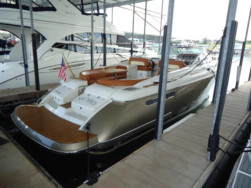 Slide: The Image of 2009 Chris-Craft Corsair 36 luxury boat docked in marina. - 41