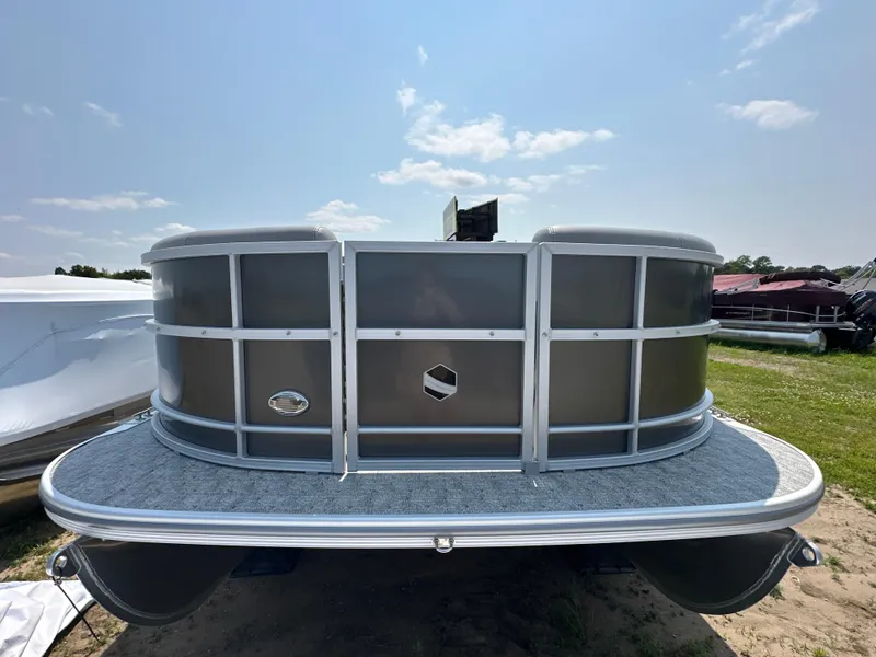 Slide: The Image of 2025 South Bay 220RSLE pontoon boat front view under clear sky. - 1
