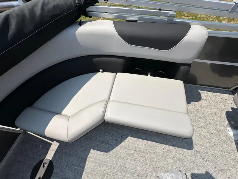 Slide: The Image of 2025 South Bay 220RSLE boat interior seating with gray and black upholstery. - 12