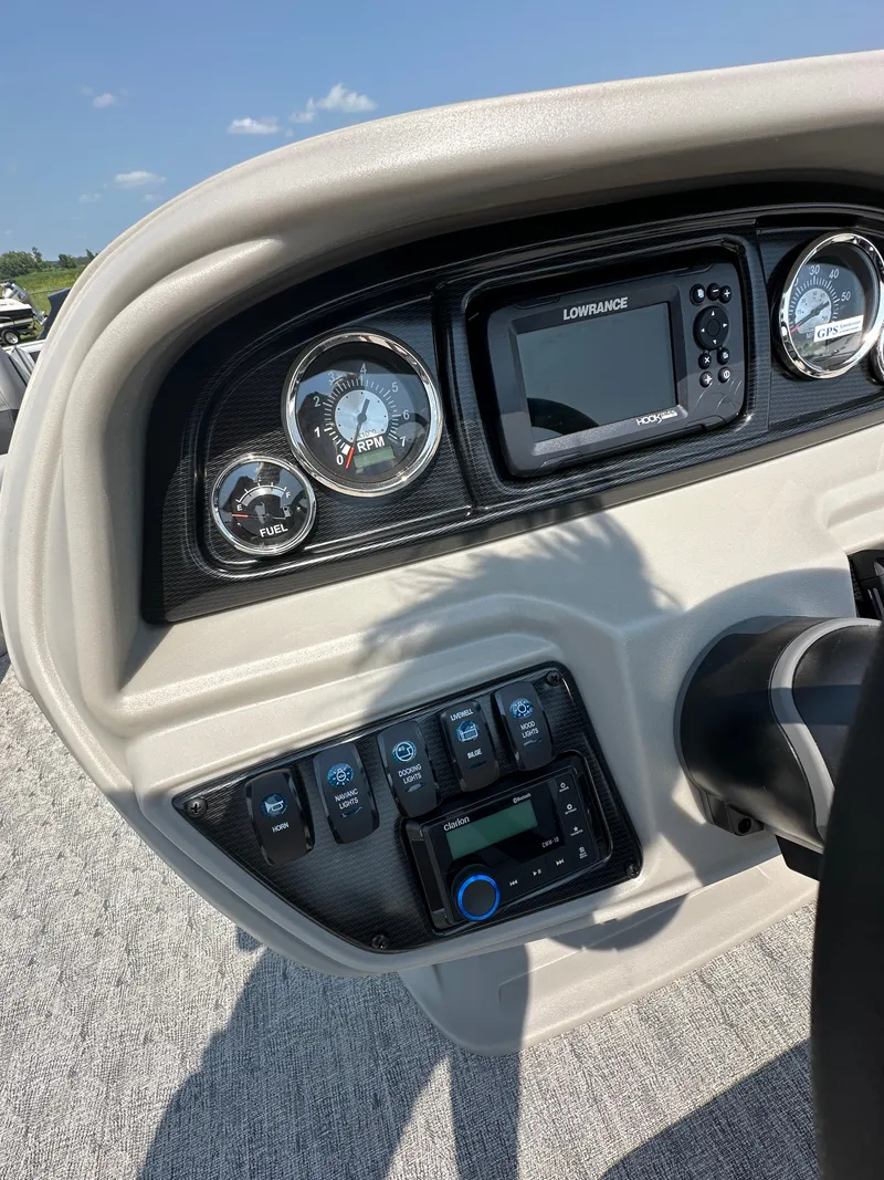 Slide: The Image of Dashboard of a 2025 South Bay 220RSLE boat with gauges and controls. - 3