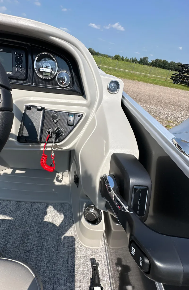 Slide: The Image of 2025 South Bay 220RSLE boat dashboard and controls. - 5