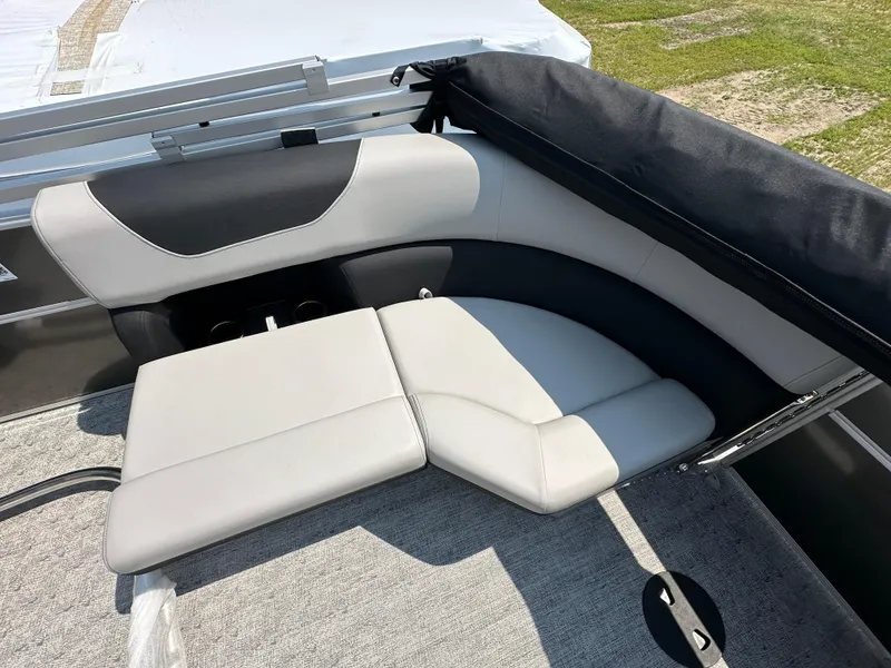 Slide: The Image of 2025 South Bay 220RSLE boat interior seating with gray and black upholstery. - 7